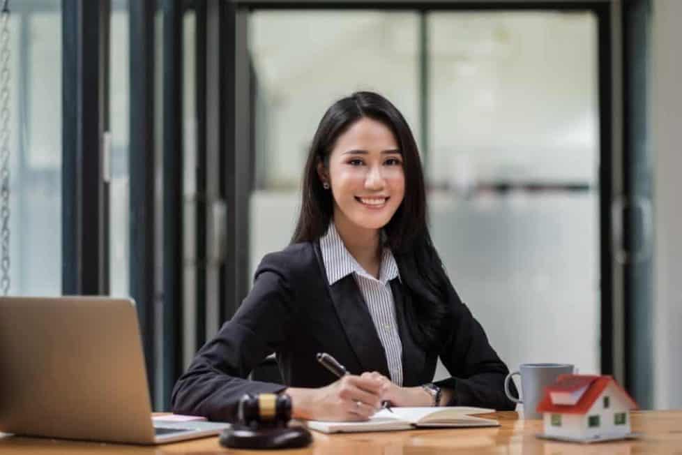 Portrait Of Business Woman And Lawyers Discussing Contract Paper